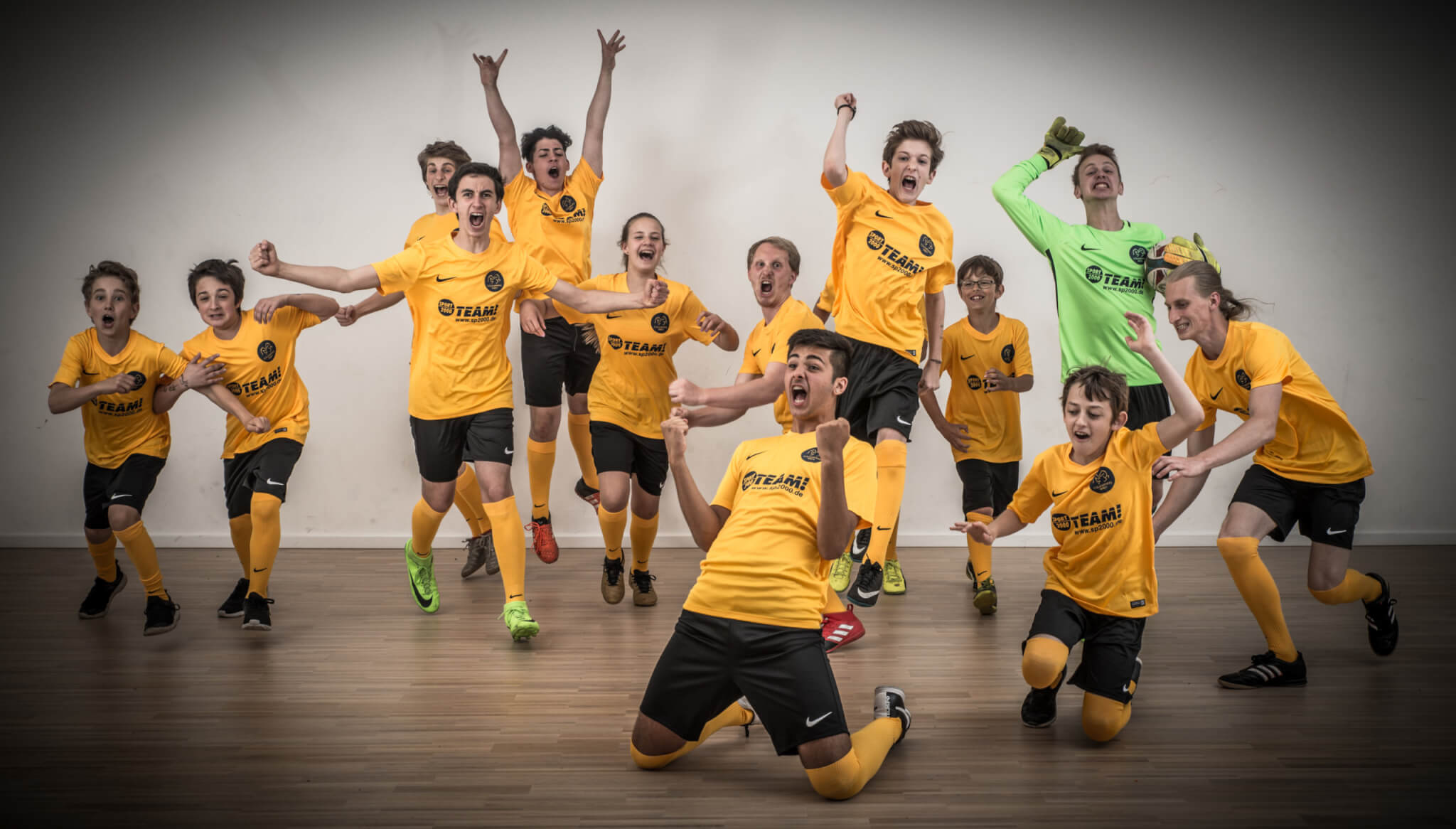 Soccer team celebrating together, representing teamwork